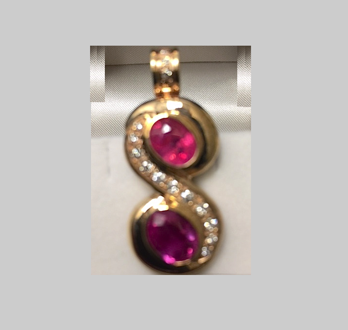 Two stone oval-cut Ruby and Diamond Pendant, 18k yellow gold